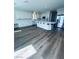 Bright, spacious kitchen features an island, white cabinets, stainless steel appliances, and new floors at 8616 Willow Cabin St, Las Vegas, NV 89131