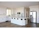 Spacious white kitchen features a large island, stainless steel appliances, and ample cabinet space at 8616 Willow Cabin St, Las Vegas, NV 89131