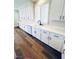 Modern kitchen with white cabinets, countertops and stainless steel appliances at 8616 Willow Cabin St, Las Vegas, NV 89131