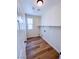 Bright laundry room with a window, shelving and wood-look floors at 8616 Willow Cabin St, Las Vegas, NV 89131