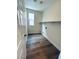 Functional laundry room boasting wood-look flooring, a window, and convenient shelving for organized storage at 8616 Willow Cabin St, Las Vegas, NV 89131