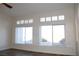 Bright living room with large windows provides natural light and backyard views at 8616 Willow Cabin St, Las Vegas, NV 89131