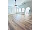 Spacious living room with wood floors, high ceilings, plantation shutters and archways at 8616 Willow Cabin St, Las Vegas, NV 89131