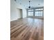 Spacious living area with large windows, and wood flooring at 8616 Willow Cabin St, Las Vegas, NV 89131