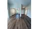 Open-concept living space with new floors, neutral walls, and views of the dining area at 8616 Willow Cabin St, Las Vegas, NV 89131