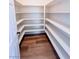 Walk-in pantry offers generous storage with open shelving and hardwood floor at 8616 Willow Cabin St, Las Vegas, NV 89131