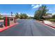 A tranquil street view showcasing the well-maintained road and the lush landscaping within the community at 8616 Willow Cabin St, Las Vegas, NV 89131