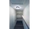 Spacious walk-in closet with shelving and wood-look flooring, illuminated by overhead lighting at 8616 Willow Cabin St, Las Vegas, NV 89131