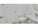 Clean, white powder room featuring a pedestal sink, modern fixtures, and a convenient location near the front door at 8852 Flora Run Ave, Las Vegas, NV 89166