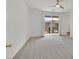 Bright, airy bedroom with neutral carpet, ceiling fan, and sliding glass doors to a balcony at 8852 Flora Run Ave, Las Vegas, NV 89166