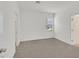 Neutrally decorated bedroom with carpeted floors and bright natural light at 8852 Flora Run Ave, Las Vegas, NV 89166