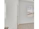Cozy bedroom with a large window, neutral paint, and carpeted floors at 8852 Flora Run Ave, Las Vegas, NV 89166