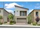 Modern two-story home featuring a balcony, low maintenance landscaping, and an attached two-car garage at 8852 Flora Run Ave, Las Vegas, NV 89166