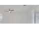 Bright living room featuring a ceiling fan, modern windows, and white walls, perfect for relaxation and entertainment at 8852 Flora Run Ave, Las Vegas, NV 89166