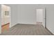 Main bedroom featuring neutral carpet and adjacent bathroom at 8852 Flora Run Ave, Las Vegas, NV 89166