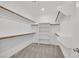 Bright walk-in closet with shelving and carpeted flooring at 8852 Flora Run Ave, Las Vegas, NV 89166