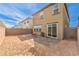 Large backyard space with brick-paved patio and access to the home via sliding glass doors at 9114 Riverlands Ranch St, Las Vegas, NV 89139