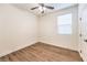 Clean bedroom with wood floors, a window, and fresh paint at 9114 Riverlands Ranch St, Las Vegas, NV 89139