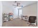 Comfortable bedroom with neutral carpet, ceiling fan, and great natural light at 9114 Riverlands Ranch St, Las Vegas, NV 89139