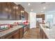 Well-equipped kitchen featuring granite countertops, stainless steel appliances, and an island with a sink at 9114 Riverlands Ranch St, Las Vegas, NV 89139