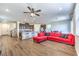 Open-concept living room with a spacious layout and updated kitchen at 9114 Riverlands Ranch St, Las Vegas, NV 89139