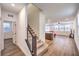 Open floor plan featuring stairs, the living room, and a view to the kitchen at 9114 Riverlands Ranch St, Las Vegas, NV 89139