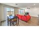 Open-concept floor plan with a sliding glass door and wood floors at 9114 Riverlands Ranch St, Las Vegas, NV 89139