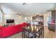 Spacious living area with a connecting dining and kitchen area at 9114 Riverlands Ranch St, Las Vegas, NV 89139