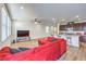 Inviting living room with a large red sectional and entertainment area at 9114 Riverlands Ranch St, Las Vegas, NV 89139