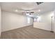 Bright and airy loft featuring neutral carpet, a ceiling fan, and natural light at 9114 Riverlands Ranch St, Las Vegas, NV 89139
