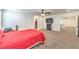 Primary bedroom featuring neutral carpet, walk-in closet and comfortable bed at 9114 Riverlands Ranch St, Las Vegas, NV 89139