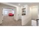 Upstairs hallway with a bedroom view and laundry closet at 9114 Riverlands Ranch St, Las Vegas, NV 89139