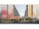 Apartment buildings with trees and pedestrians on the street at 924 S First St # 306C, Las Vegas, NV 89101