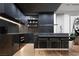 Sleek, modern kitchen with dark cabinetry and premium appliances at 924 S First St # 306C, Las Vegas, NV 89101