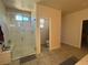 Updated bathroom featuring a tiled glass-enclosed shower and ceramic tile flooring at 933 Kimbark Ave, Las Vegas, NV 89148