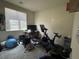 Bedroom with workout area including stationary bike at 933 Kimbark Ave, Las Vegas, NV 89148