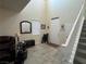Open entryway with neutral tile, high ceilings, and staircase at 933 Kimbark Ave, Las Vegas, NV 89148