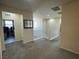 Upstairs hallway with neutral carpet leading to bedrooms and laundry room at 933 Kimbark Ave, Las Vegas, NV 89148