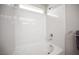 A bathtub with white marble walls and a chrome shower head at 9807 Panther Hollow St, Las Vegas, NV 89141