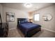 Bedroom with carpet, black furniture, light gray walls and a window for natural light at 9807 Panther Hollow St, Las Vegas, NV 89141