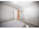 Bedroom with a large closet, carpet and door to an adjoined room at 9807 Panther Hollow St, Las Vegas, NV 89141