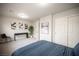 This bedroom features gray walls, neutral carpet and a closet with white doors at 9807 Panther Hollow St, Las Vegas, NV 89141