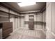 Spacious walk-in closet with custom shelving and drawers for organized storage at 9807 Panther Hollow St, Las Vegas, NV 89141