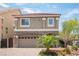 Two-story home boasts a neutral color palette and stone accents at 9807 Panther Hollow St, Las Vegas, NV 89141