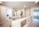 Upstairs hallway with neutral decor leads to bedrooms and bathrooms at 9807 Panther Hollow St, Las Vegas, NV 89141