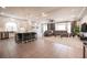 The kitchen and living room showcase an open floor plan, stylish decor, and great natural light at 9807 Panther Hollow St, Las Vegas, NV 89141