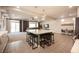 Bright kitchen with a large island, seating, stainless steel appliances, and modern pendant lighting at 9807 Panther Hollow St, Las Vegas, NV 89141