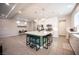 Open kitchen features a large island with seating and stainless steel appliances at 9807 Panther Hollow St, Las Vegas, NV 89141