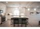 Open kitchen features a large island with seating and stainless steel appliances at 9807 Panther Hollow St, Las Vegas, NV 89141