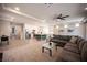 Expansive living room flows into an open kitchen featuring a large center island at 9807 Panther Hollow St, Las Vegas, NV 89141